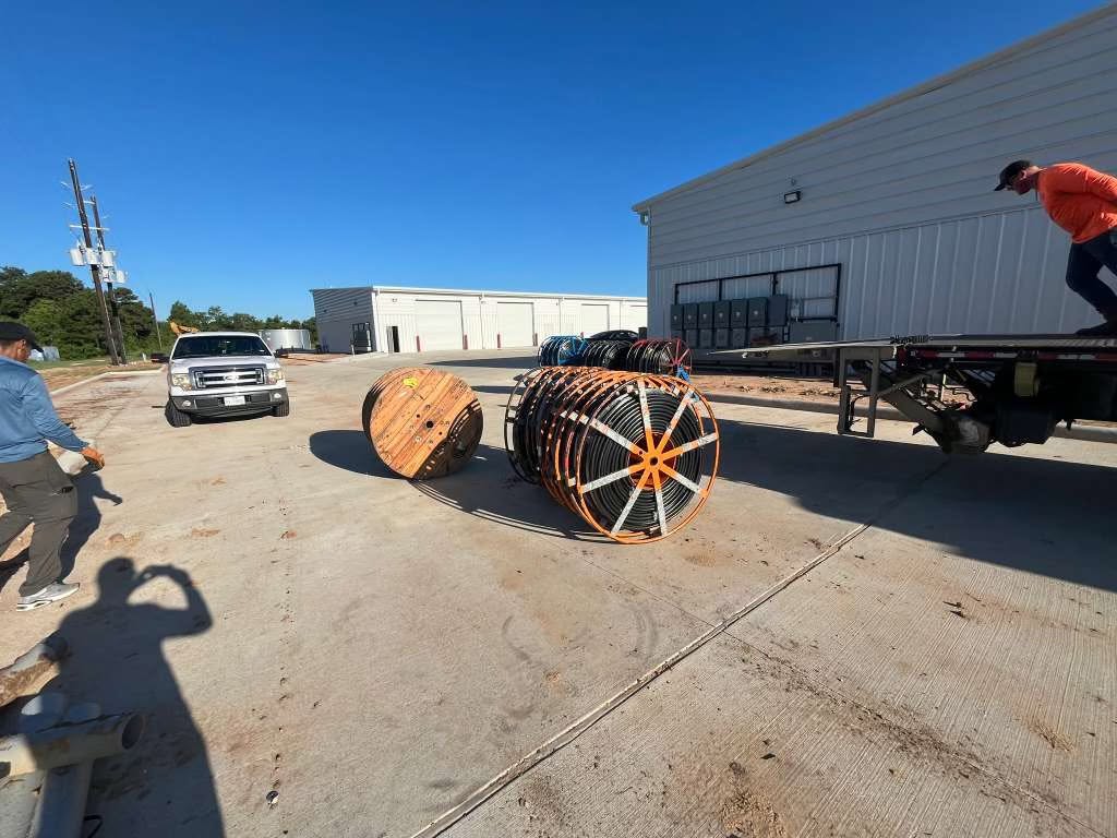Large cable reels staged at job site
