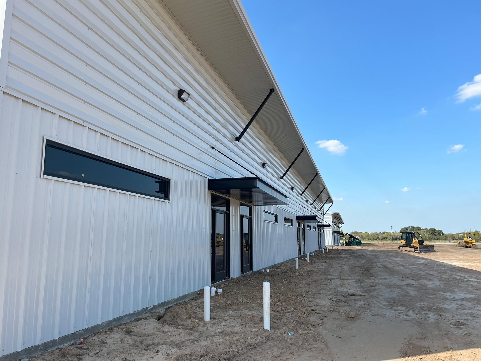 Commercial building with conduit stub-ups on site
