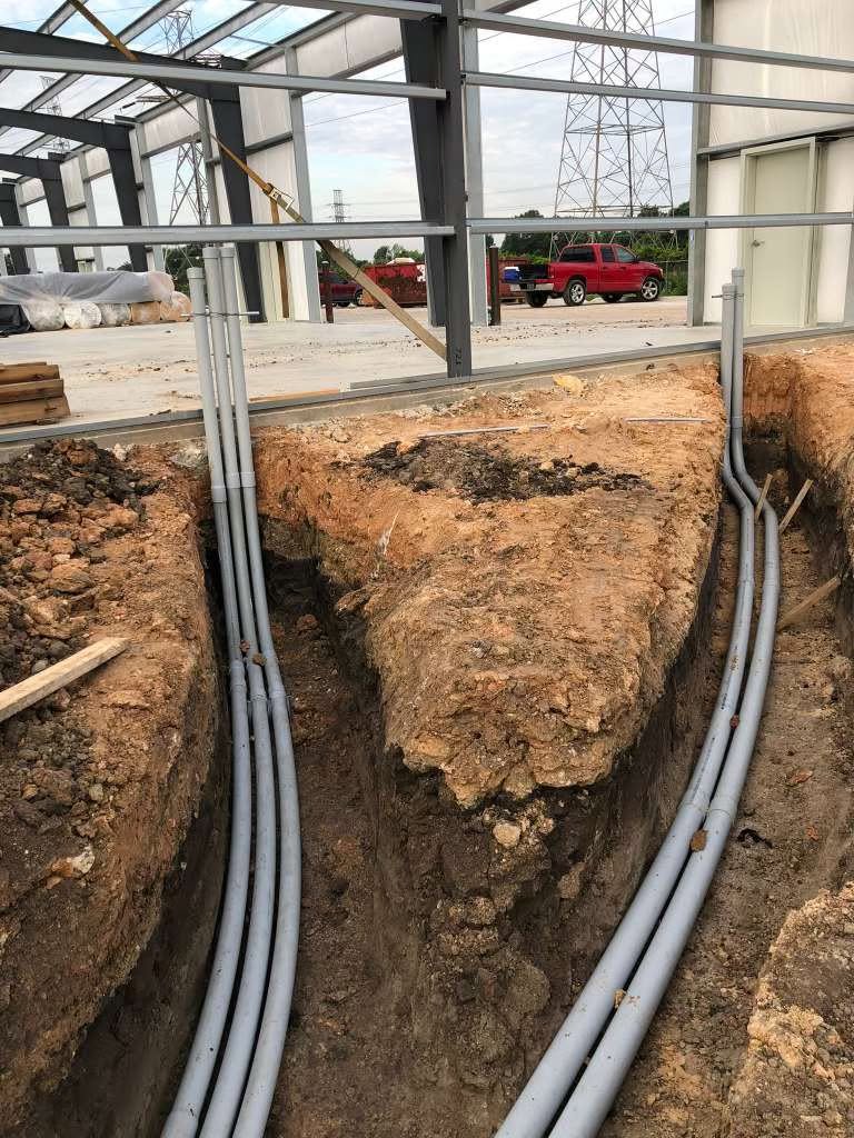 Trenches with underground PVC electrical conduits
