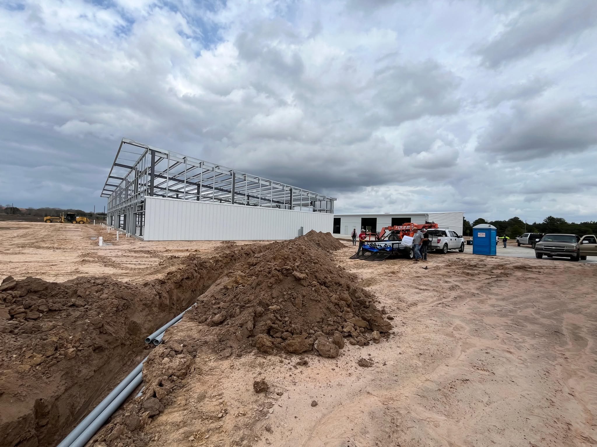 Trench with underground conduits to new building