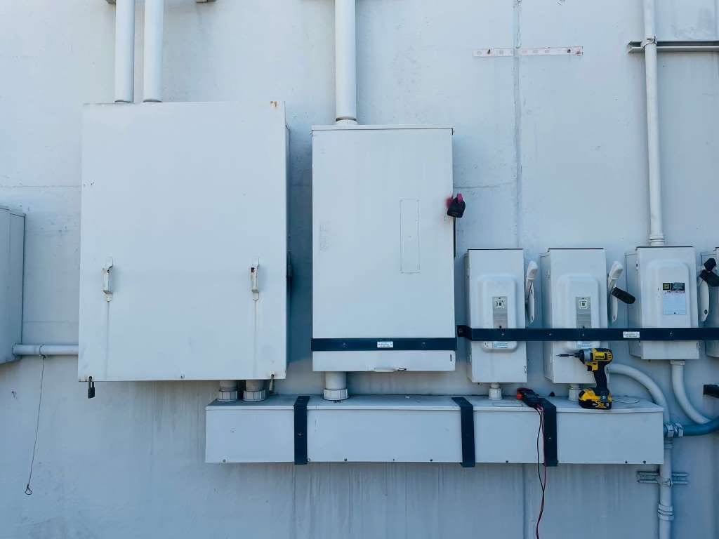 Bank of disconnect boxes and wireway being installed